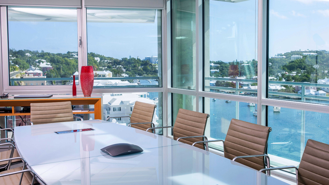 Windows overlooking Bermuda landscape from an empty conference room in the Liberty Specialty Markets office