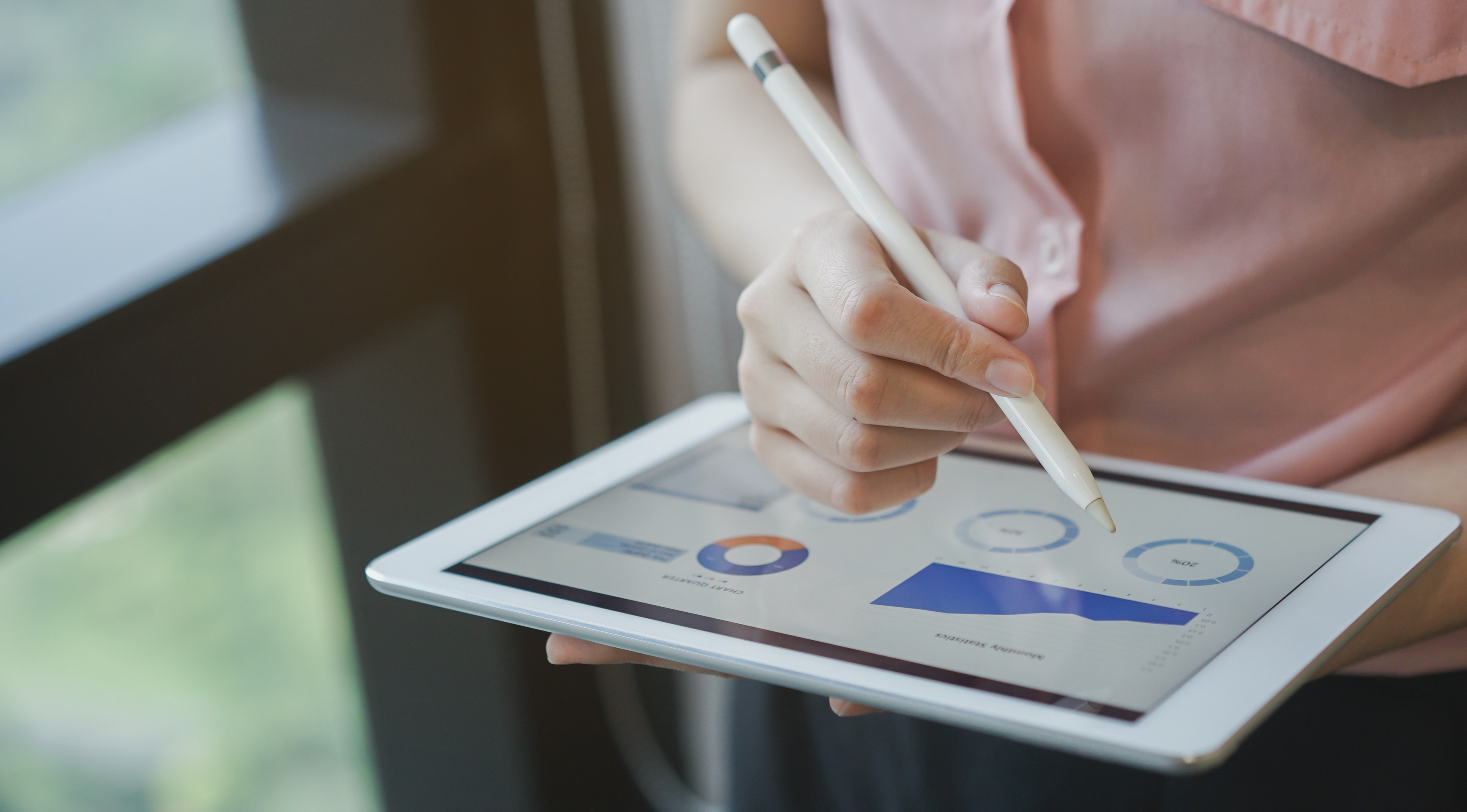 person on a tablet with data